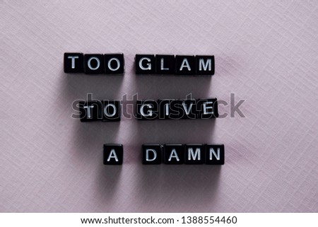 Too glam. To give. A damn on wooden blocks. Motivation and inspiration concept