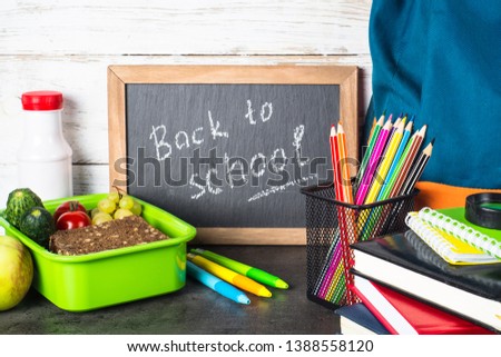 Back to school concept. School and office supplies, backpack and lunch box .