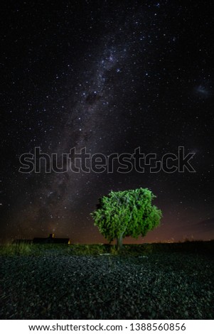 New Zealand. Milky Way above Lake Te Anau. In the zenith of the Southern Cross constellation and Magelan clouds