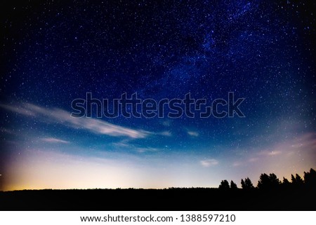 Milky Way with Neptune and Saturn planets in the night sky.