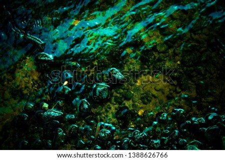 Abstract colorful liquid water background close up