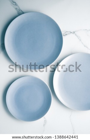 Blue empty plate on marble, flatlay - stylish tableware, table decor and food menu concept. Serve the perfect dish
