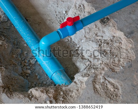 pipe Plumbing PVC blue water main broken. Use the drill to drill the concrete floor. To repair Royalty-Free Stock Photo #1388652419