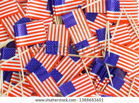 background wallpaper-jumble of red, white and blue American flag cupcake toothpicks