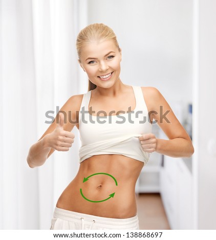 picture of beautiful sporty woman with arrows on her stomach
