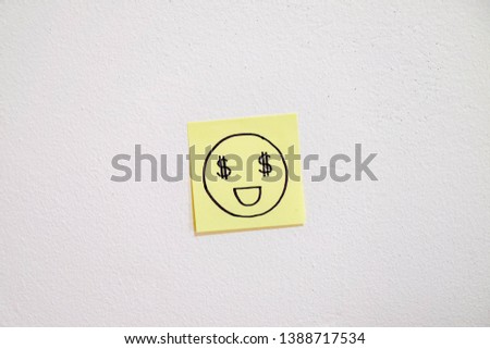 Drawing of dollar smiling face on sticky paper