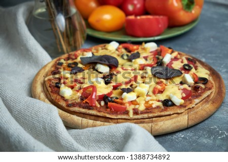 Slice of hot pizza large cheese lunch or dinner crust seafood meat topping sauce. with bell pepper vegetables delicious tasty fast food italian traditional on wooden board table classic in view pic