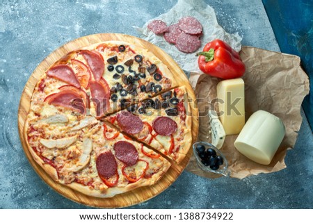 Slice of hot pizza large cheese lunch or dinner crust seafood meat topping sauce. with bell pepper vegetables delicious tasty fast food italian traditional on wooden board table classic in view pic