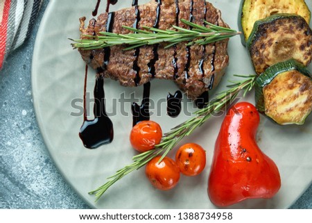 grilled beef steak with vegetables on plate pic