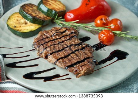 grilled beef steak with vegetables on plate pic