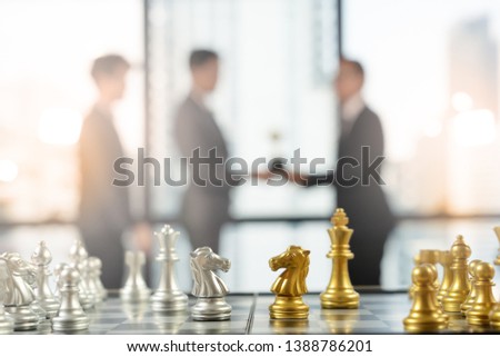 Chess piece and Chess board with success businessman on background, strategic situation, confrontation and competition among two partie