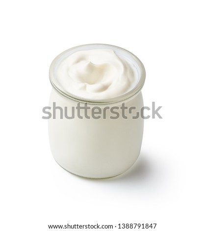 Fresh natural homemade organic yogurt in a glass jar isolated on white background Royalty-Free Stock Photo #1388791847