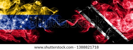 Venezuela vs Trinidad and Tobago smoky mystic flags placed side by side. Thick colored silky smoke flags of Venezuela and Trinidad and Tobago.