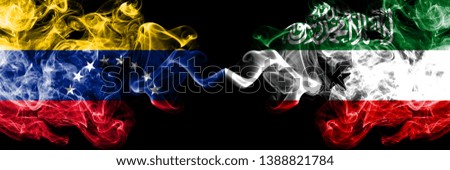 Venezuela vs Somaliland smoky mystic flags placed side by side. Thick colored silky smoke flags of Venezuela and Somaliland.