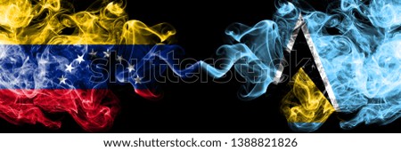 Venezuela vs Saint Lucia smoky mystic flags placed side by side. Thick colored silky smoke flags of Venezuela and Saint Lucia.