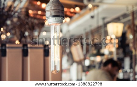 Rustic warm cafe lights alongside vast amounts of natural outdoor lighting