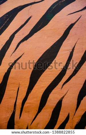 Tiger stripes painted on the wall