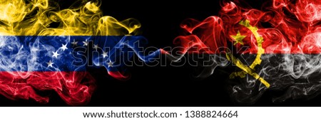 Venezuela vs Angola, Angolan smoky mystic flags placed side by side. Thick colored silky smoke flags of Venezuela and Angola, Angolan.