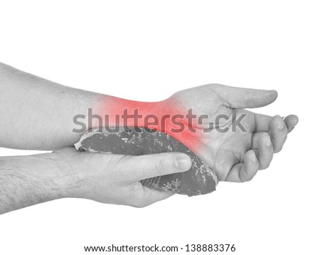 Cool gel pack on a swollen hurting wrist. Medical concept photo. Isolation on a white background. Color Enhanced skin with read spot indicating location of the pain.