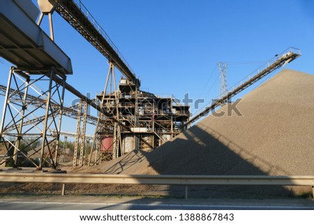 Gravel works - conveyor belt, gravel sorting machines in the valley of the river Leine, district Northeim, Lower Saxony, Germany 