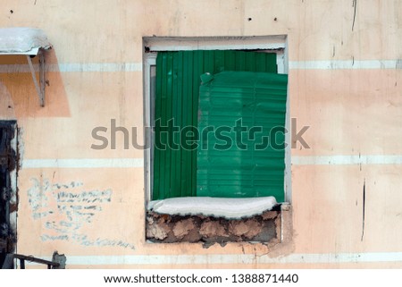 Old sheet metal closed window for exterior design. Antique and grunge style. Closed surface window photography on the old wall. 
