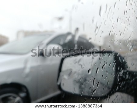 Driving through a rain-spattered glass. Selective focus