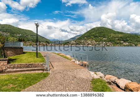 Pedestrian walk along the lake Lugano in Lavena Ponte Tresa, province of Varese, Italy