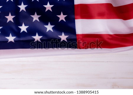 American flag on white wooden background for Memorial Day or 4th of July with copy space.