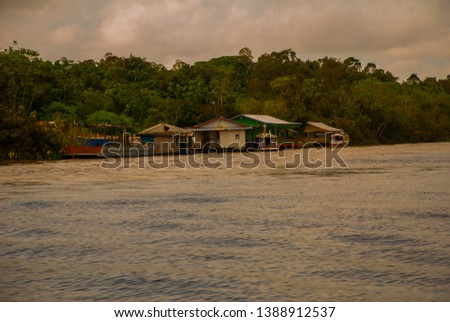 Manaus, Amazonas, Brazil: The merger of the two colored river, Rio Negro, Solimoes. Meeting, multi-colored waters do not mix, and continue the way side by side, thus each river remains with the own