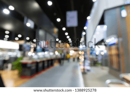 Abstract blur people in exhibition hall event trade show expo background. Large international exhibition, convention center, MICE industry business concept