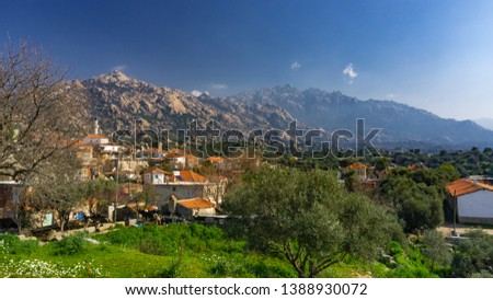 Latmos (Besparmak) Mountain and the village of Kapikiri among the ruins of Heracleia. Milas, Aydin, Turkey. Royalty-Free Stock Photo #1388930072