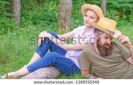 Reasons you should definitely wear more hats. Hats for tourism. Choose proper clothing and equipment to hike and forest picnic. Couple tourists wearing hats. Couple in straw hats sit meadow relaxing.