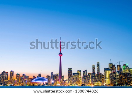 Night view of iconic landmarks and buildings of Toronto city skyline from Centre Island, Canada