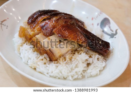 Chinese roast pork and goose on rice. Roasting is a cooking method using dry heat with hot air enveloping the food, cooking it evenly on all sides. Roasting can enhance flavor.