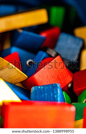 Colorful wooden building blocks on floor - Selective focus