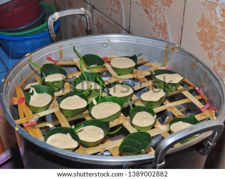 Kue Apem. Cakes made from rice flour wrapped in jackfruit leaves and steamed. Indonesian traditional food