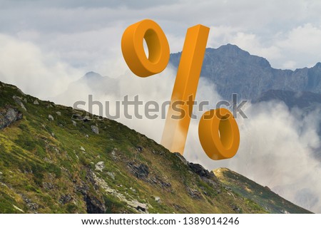 Big orange percent sign in the middle of foggy mountain landscape. Natural and surreal background.