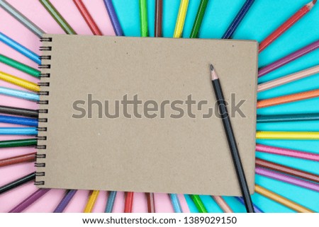 School notebook and various stationery. Back to school concept. Multicolored background.