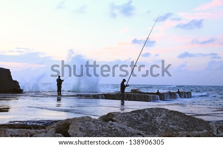 Two men fishing in the early morning