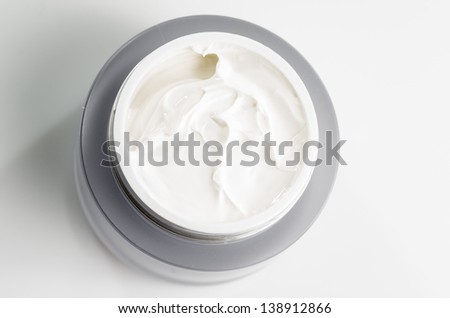 macro photography face cream on white background