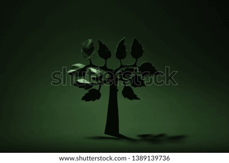cardboard tree on green background