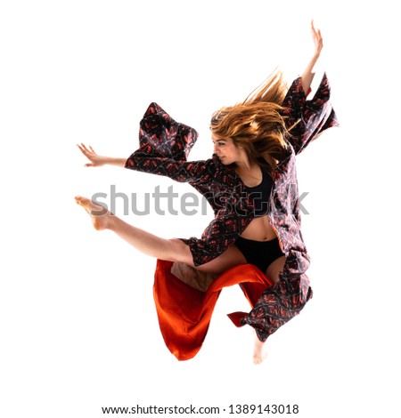 Young dance girl with kimono jumping