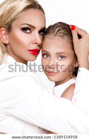 Happy mother's day! child daughter and mother embraced, cuddling - Image. Mother and daughter concept.