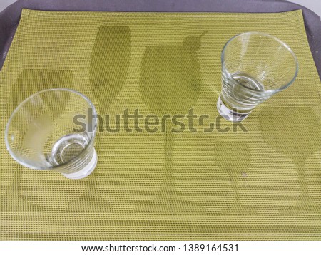 Preparation of serving a glass of water.