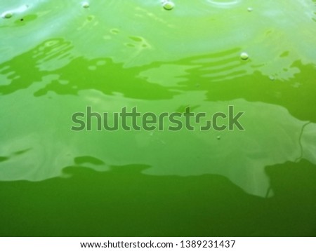 Blurred image of bubbles and water waves on the green surface, texture of green bubbles, Blurred image of Green water background