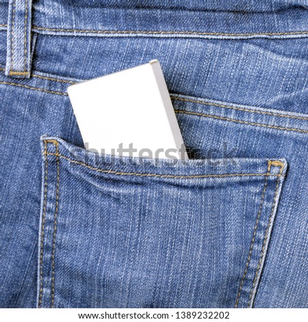Blank white box mockup with copy space to add text in the back pocket of blue jeans 