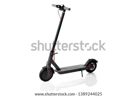 Electric Scooter. Electric Scooter on a white background. Electric transport. Royalty-Free Stock Photo #1389244025