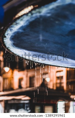 Artistic image of blue fountain dripping