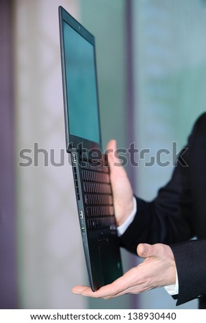 businessman holding a notebook