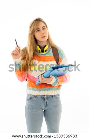 Portrait of happy teenager girl or young college student woman thinking in creative ways to success, creating new ideas, exams, learning new languages or future studies. Isolated on white background.